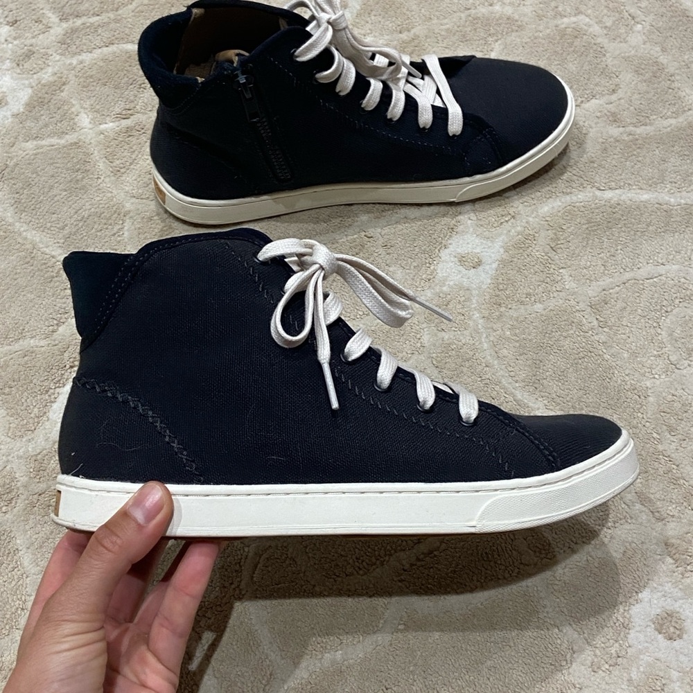 OluKai women’s black and pilahi White High-Top Sneakers